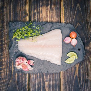 Cod fillet on a slate background