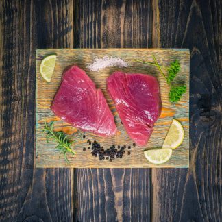 Tuna steaks on a chopping board
