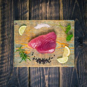 Tuna steak on a chopping board