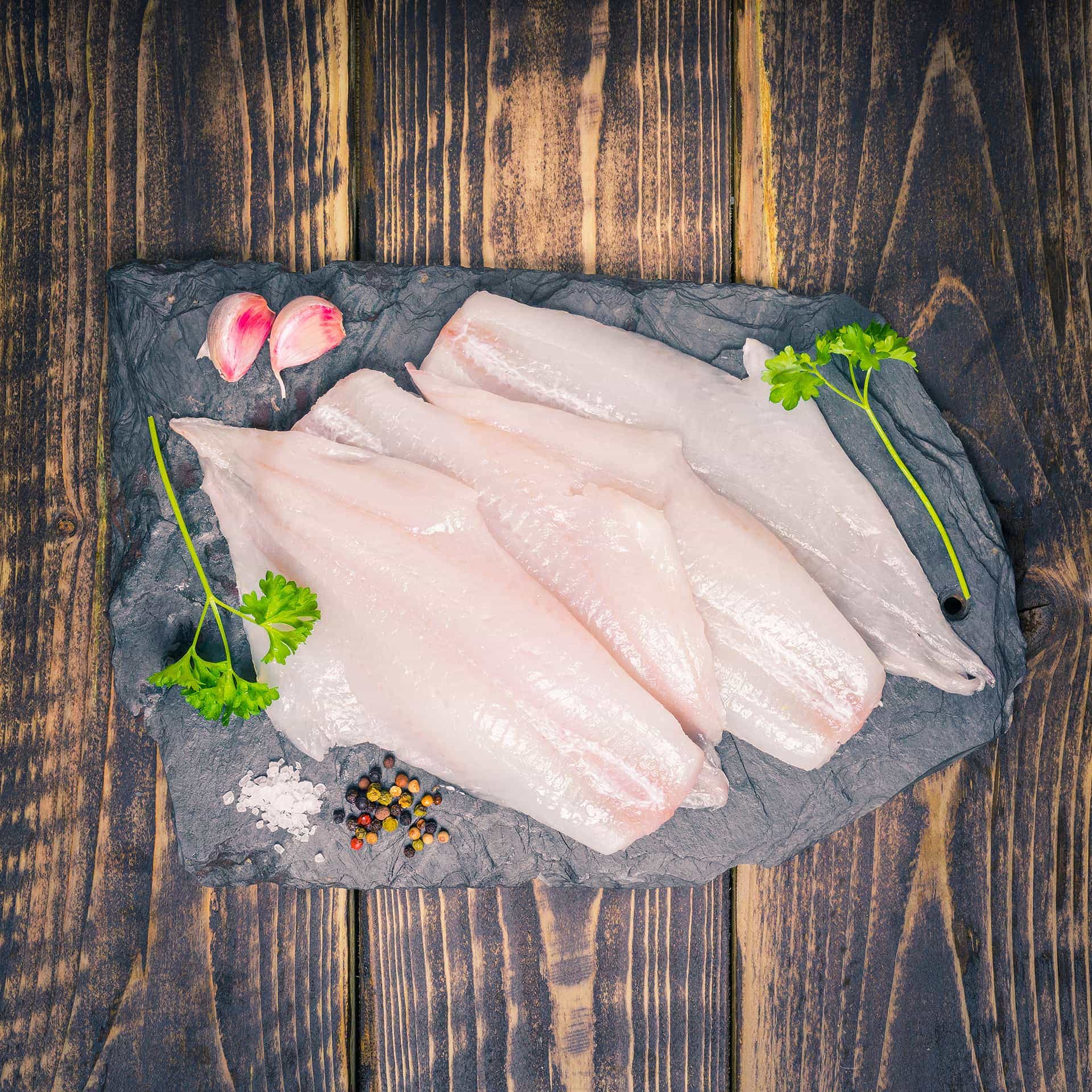 Haddock fillets on a slate background