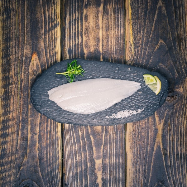 Lemon sole on a slate background