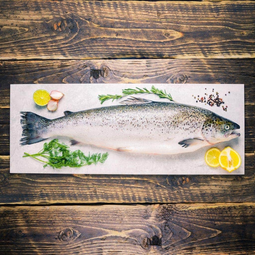Whole salmon on a stone background