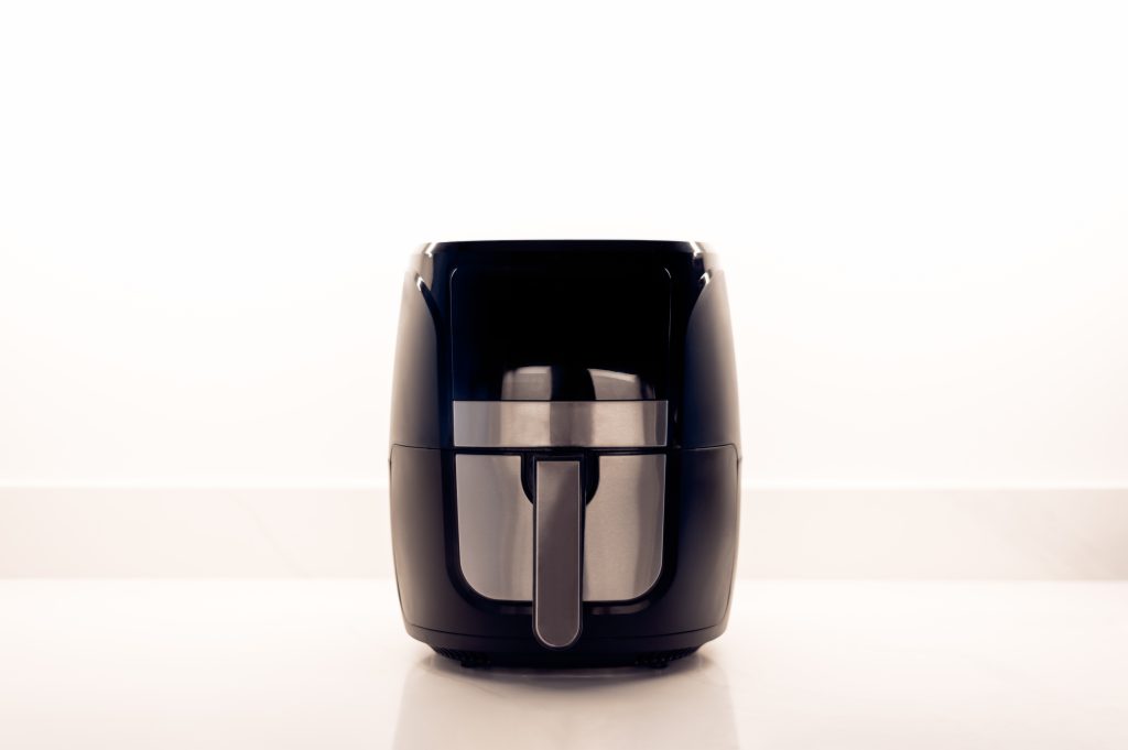 An air fryer on a kitchen worktop