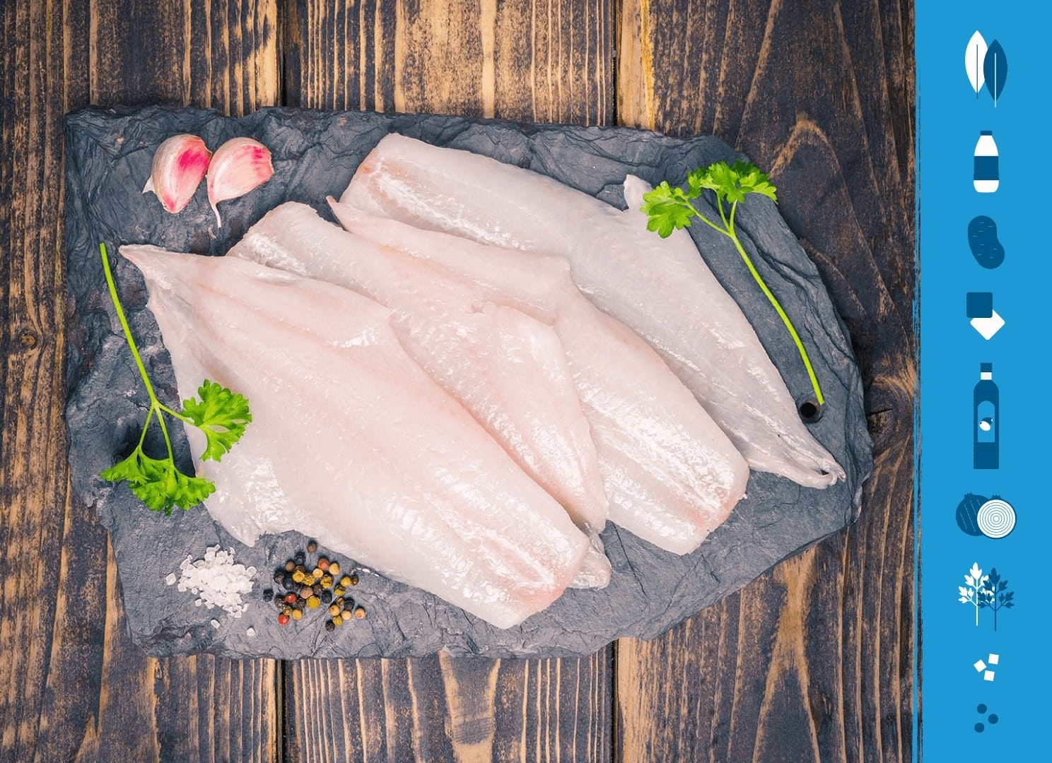 Haddock fillets on a slate background next to illustrations of the ingredients needed to make Cullen Skink